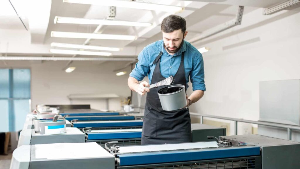 Typographer with paint at the manufacturing